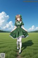 A girl in a green dress standing in a field.